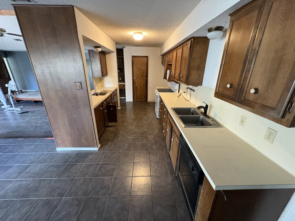 Kitchen with cabinets and tile floor