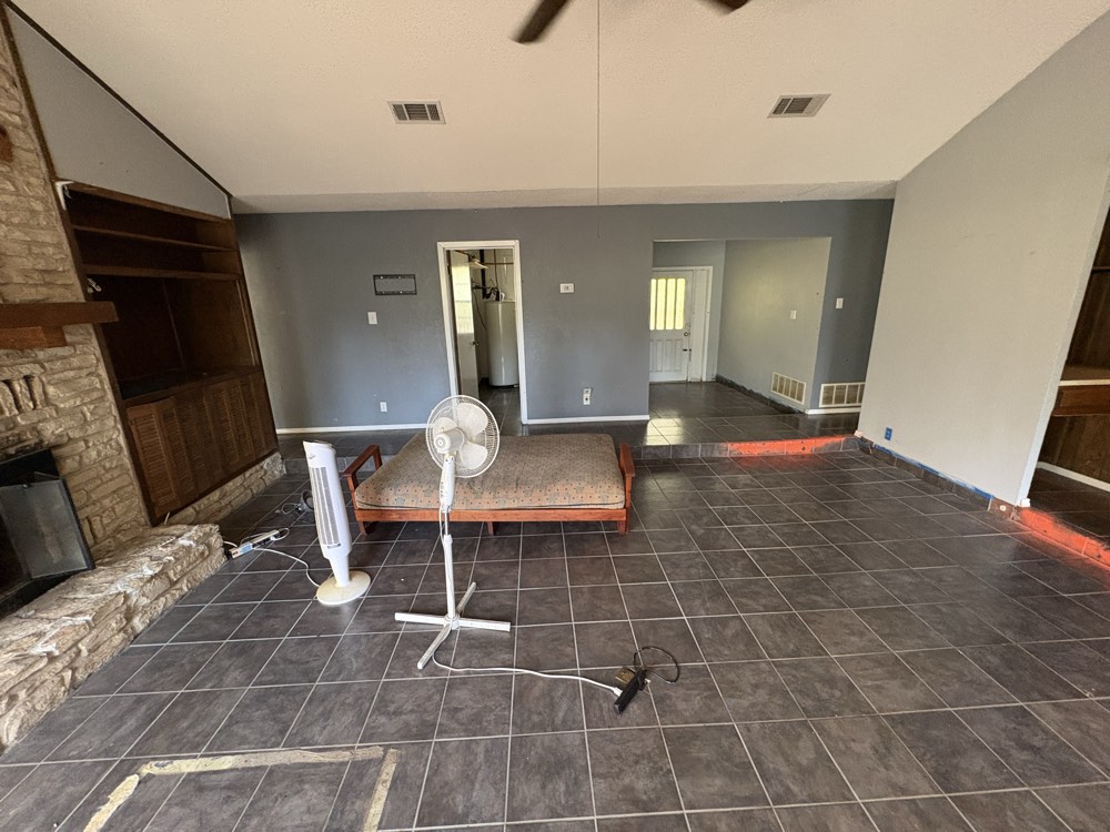 Living room with stone fireplace